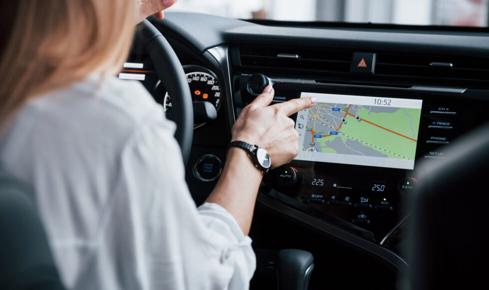Go get some fuel. Beautiful blonde girl sitting in the new car with modern black interior Go get some fuel. Beautiful blonde girl sitting in the new car with modern black interior.
